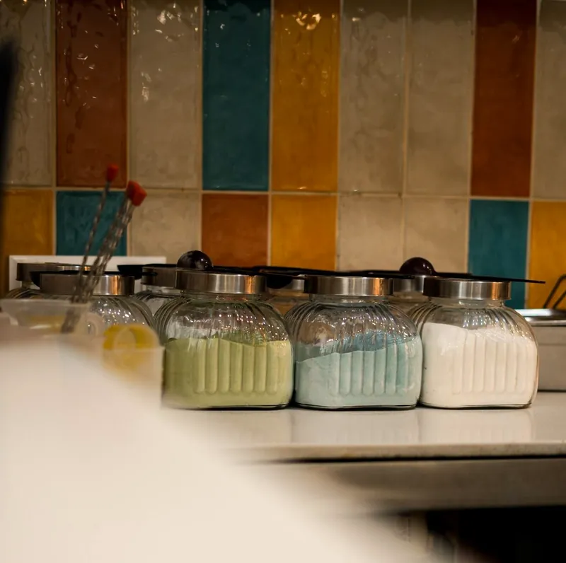 Topping jars on the tiled counter