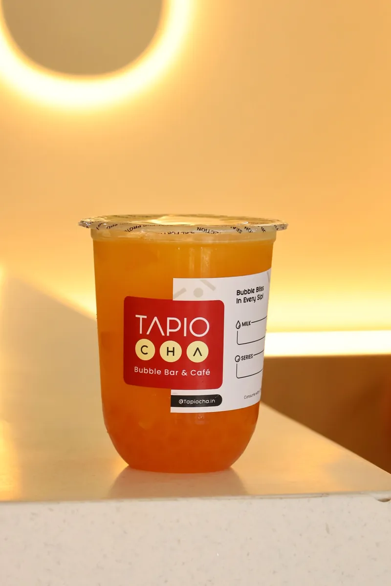 An orange fruit tea on the counter at Jubilee Walk