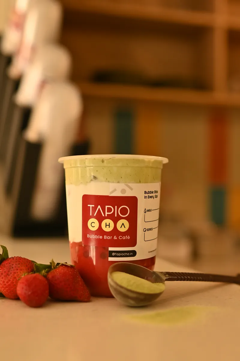 A strawberry matcha on the table in the Tapiocha café